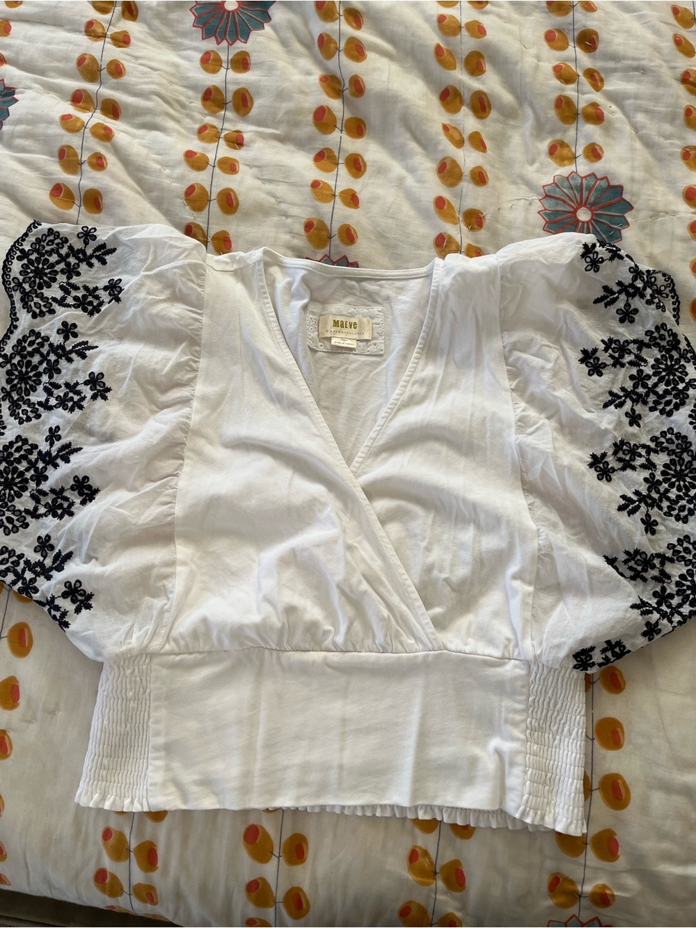 Anthropologie White Puff-Sleeve Wrap Top with Navy Floral Embroidery